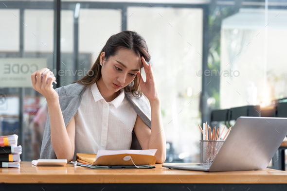 Business woman feeling stress, burnout, upset about job failure, paperwork mistakes, overwork