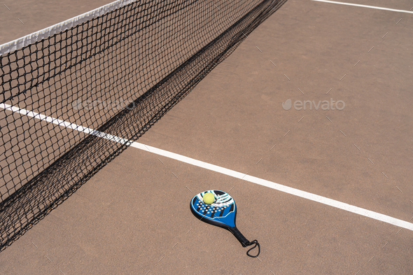 Padel racket and balls on court Stock Photo by diignat | PhotoDune