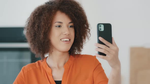 Phone Calling Online at Home Kitchen African Happy Friendly Girl Woman Wave Hello Greeting Video alt