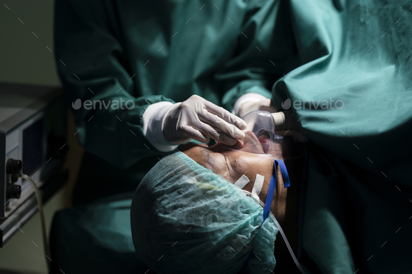 Anesthesiologist wearing a mask to anesthetize the patient for surgery. - Stock Photo - Images