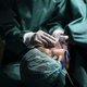 Anesthesiologist wearing a mask to anesthetize the patient for surgery. - PhotoDune Item for Sale