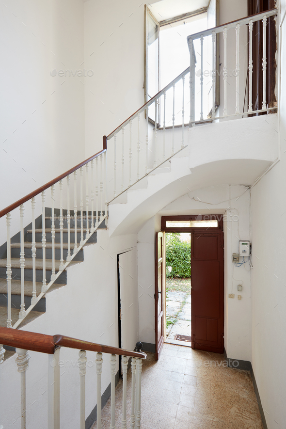 Staircase with white walls in old country house - Stock Photo - Images