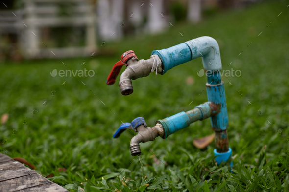 Double faucet in the backyard Stock Photo by Studio_OMG | PhotoDune