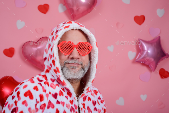 Valentines Day Portrait Of Gray Haired Man Wearing Heart Shaped Glasses And Bathrobe Stock 6669