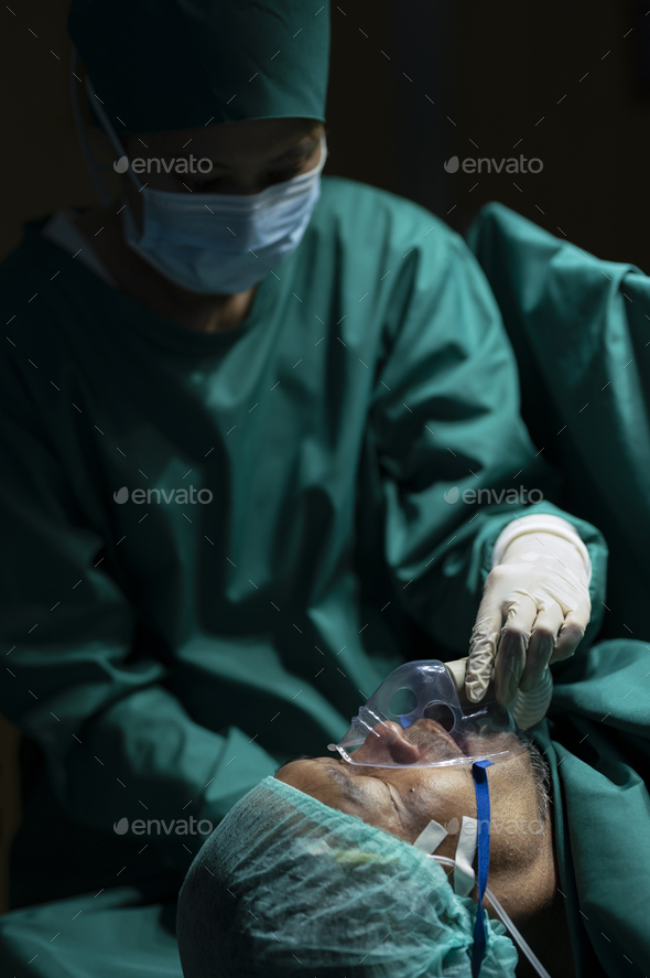 Anesthesiologist wearing a mask to anesthetize the patient for surgery. - Stock Photo - Images