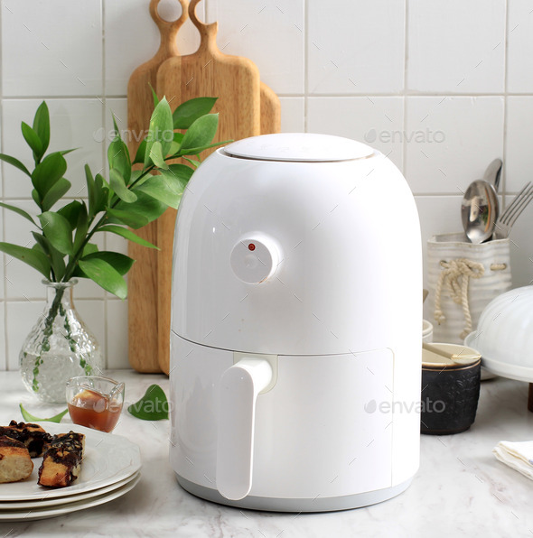 White Mini Air Fryer for Healthy Cooking in the Kitchen. White Kitchen  Concept Stock Photo by ikadapurhangus