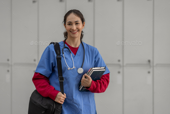 Portrait of Cheerful Indian beautiful Asian female doctor posing and Standing workplace healthcare