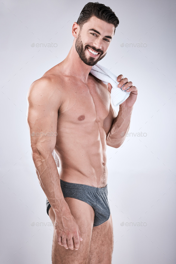 Fitness, body and beauty man isolated on a white background for exercise,  aesthetic and muscle goal Stock Photo by YuriArcursPeopleimages