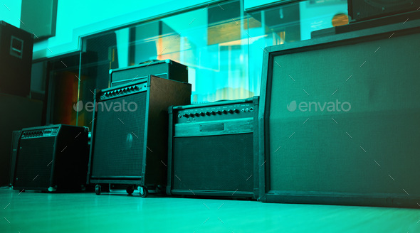 Vintage, retro and old speakers or music equipment in studio or room with neon blue light for enter
