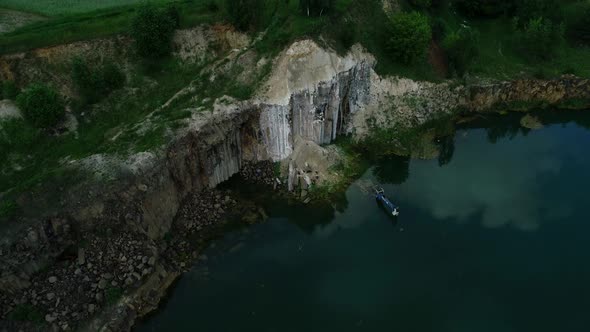 Flooded Excavator in Basaltic Quarry Lake