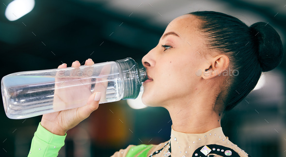 women with bottles of water in gym, Stock image