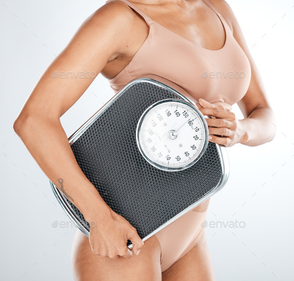 Lose weight, woman or scale for body measurement, diet or healthcare wellness management on isolate