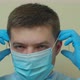Pandemic Protection of the Covid-19 Coronavirus. Portrait of a Young Male Doctor in a Medical Face - VideoHive Item for Sale