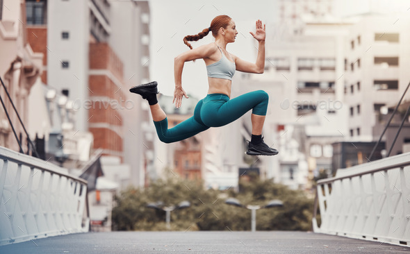 Workout, jump and health with woman in city for training, cardio and endurance. Energy, fitness and