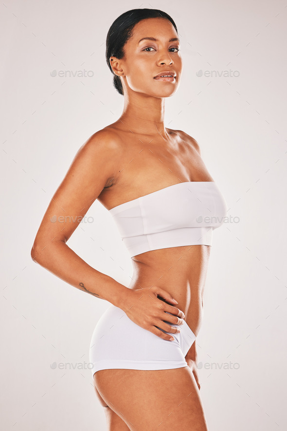 Body, fitness and underwear with a model woman in studio on a gray  background to promote health or Stock Photo by YuriArcursPeopleimages
