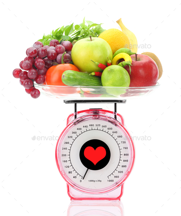 Kitchen scale weighting apples, Stock image