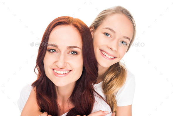 Happy Mother And Daughter Hugging And Smiling At Camera Isolated On