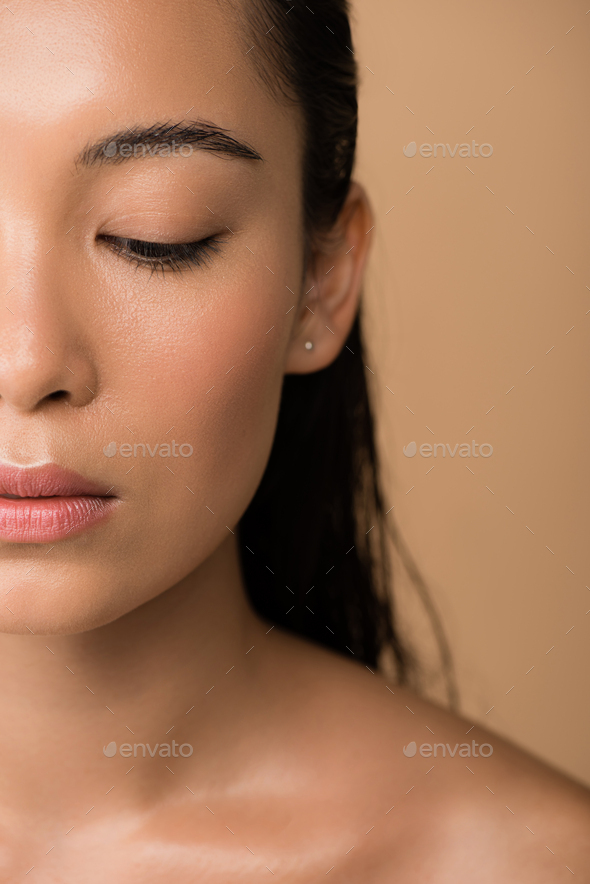 Asian Looking Down Nude - cropped view of beautiful naked asian girl looking down isolated on beige  Stock Photo by LightFieldStudios