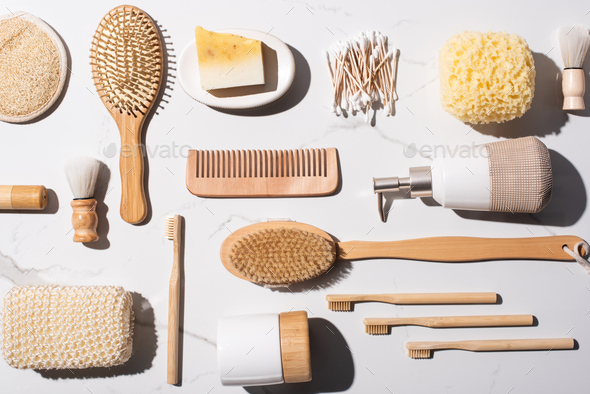 Top view of comb, ear sticks, sponges, Hair brushes, liquid soap dispenser, shaving brushes,