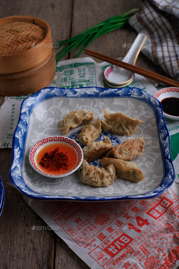 English Translation : Gyoza, Steamed and Grilled Dumpling Stuffed with Cabbage