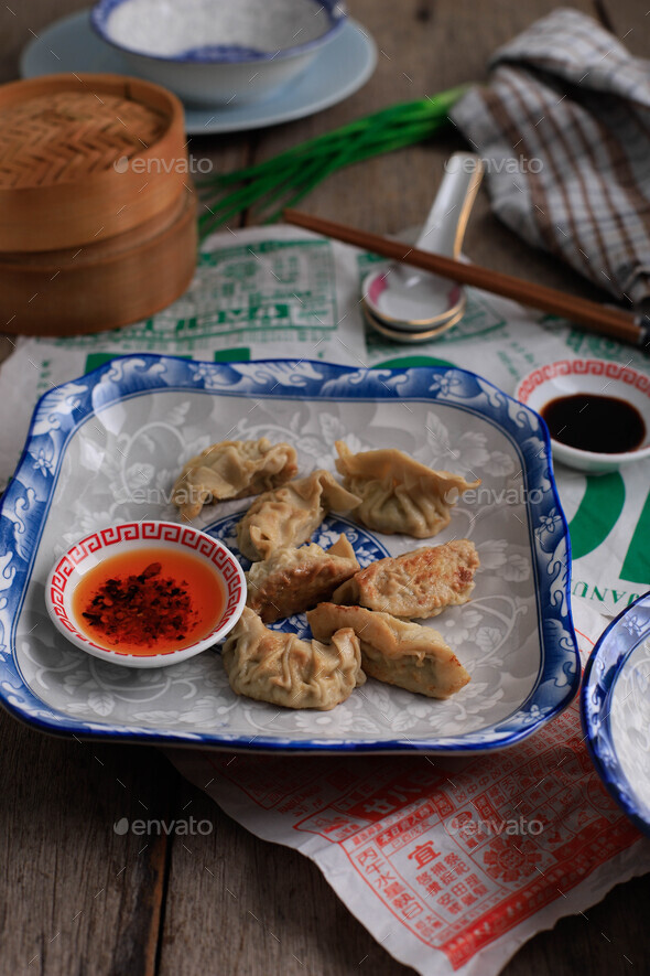 English Translation : Gyoza, Steamed and Grilled Dumpling Stuffed with Cabbage