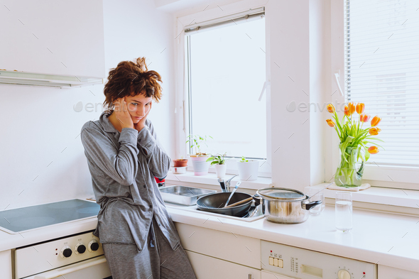 Fatigue and seasonal depression, household chores routine, young lonely woman morning