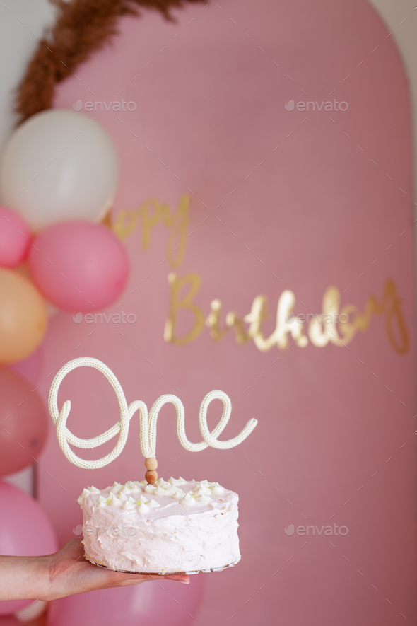 birthday cake with cream and flowers on white background. Celebrating first year of birth.
