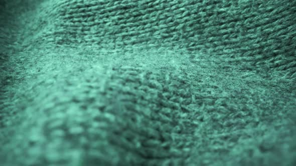 Extreme detail view of sheep wool cloth texture flowing in macro