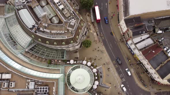 Drone View of Street with a Shopping Center and Residential Buildings in London