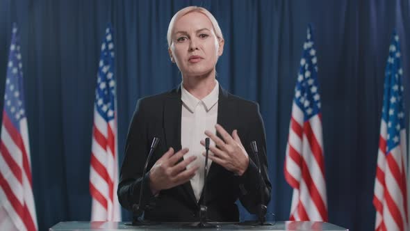 Elegant Woman Speaking On Camera alt