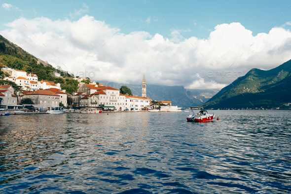 Stone houses with tiled roofs on the Perast embankment. Montenegro ...