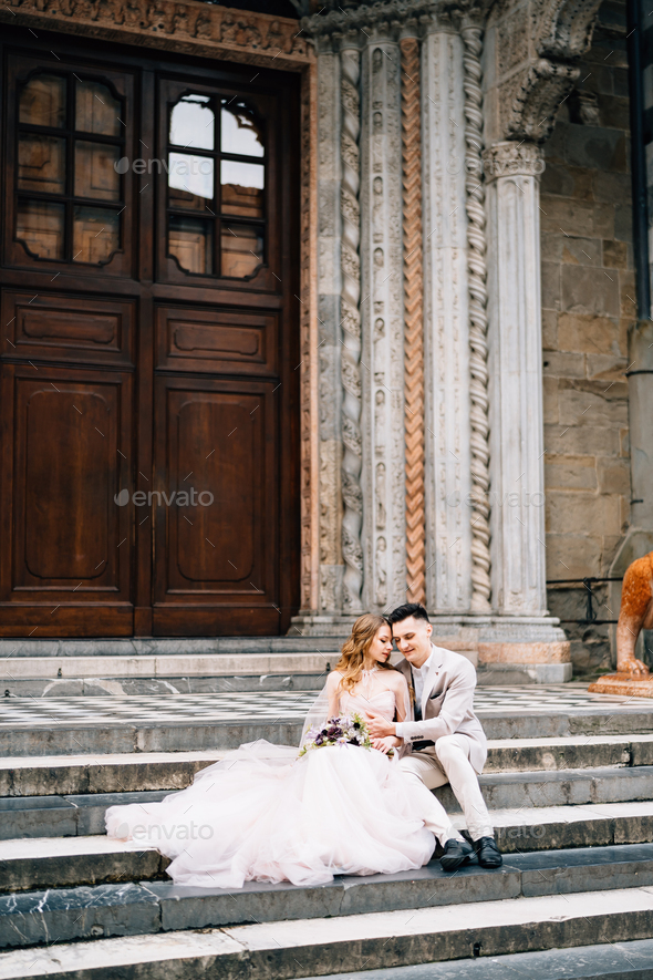 Entrance to the Basilica of Santa Maria Maggiore in Rome. Newlyweds are sitting on the steps