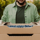 Farmer hands taking and holding cardboard box full of containers with blueberry - PhotoDune Item for Sale