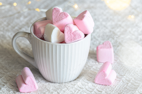 Pink heart shaped marshmallows on white background Stock Photo by