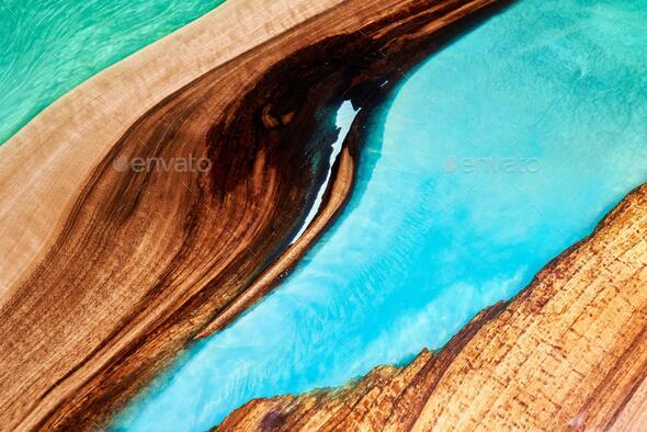 Texture of a wooden table with epoxy resin. Stock Photo by Sandsun