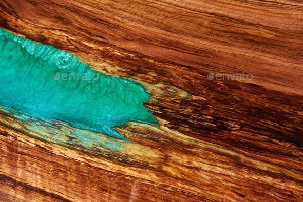 Texture of a wooden table with epoxy resin. Stock Photo by Sandsun