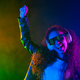 Happy woman in headphones dancing in neon light, smoke background. Z generation - PhotoDune Item for Sale