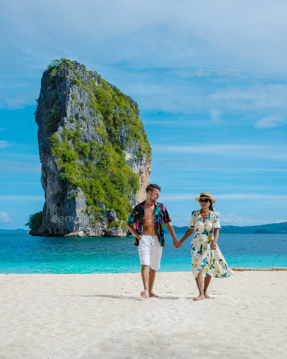 Koh Poda Krabi Thailand, Asian woman and European men walking on the tropical beach of Koh Poda - Stock Photo - Images