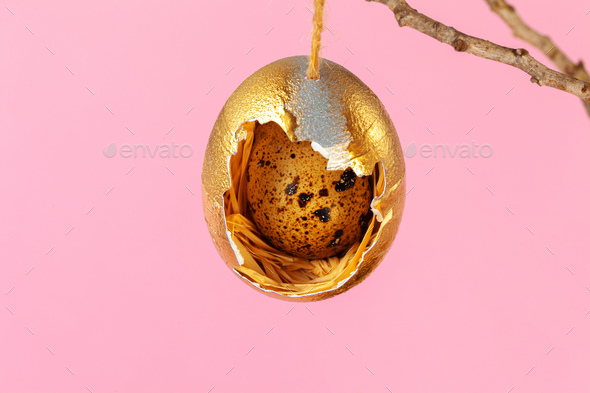 Easter decor, eggshells painted golden with quail egg inside
