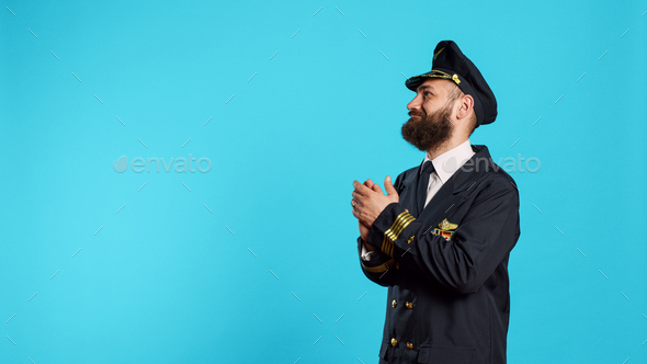 Aircrew captain pointing to left or right sides in studio