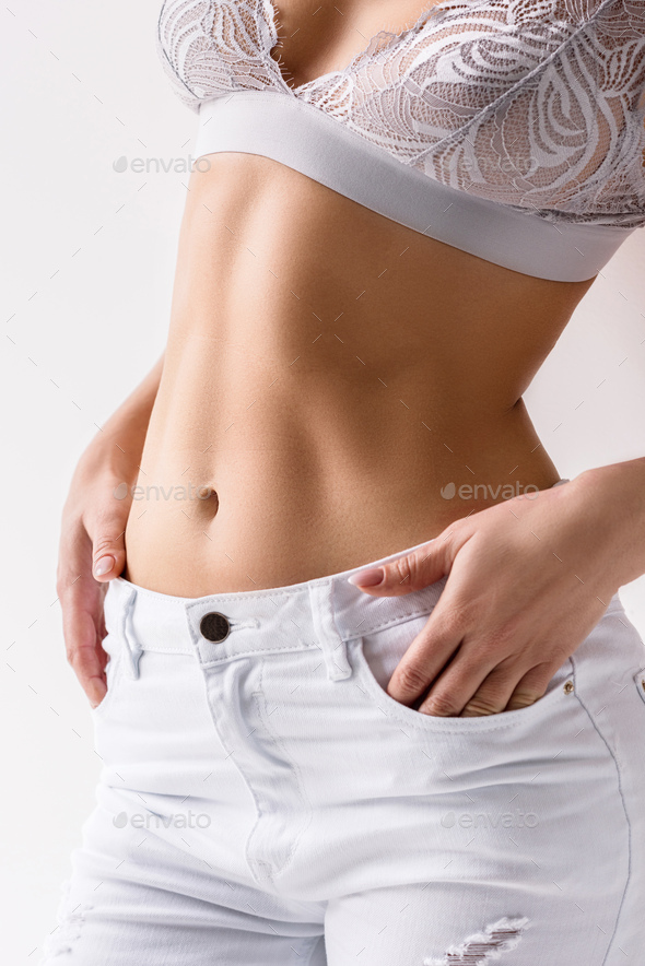 Woman In Lace Bralette And White Jeans Stock Photo, Picture and