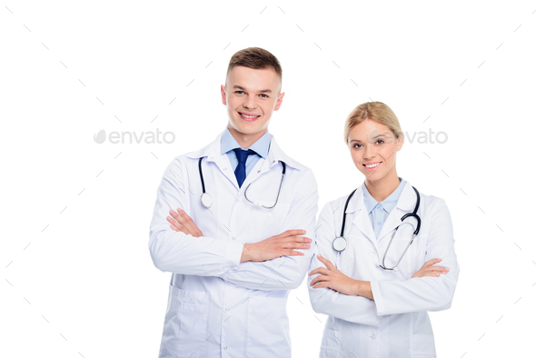 Male And Female Doctors In White Coats With Stethoscopes And Crossed 