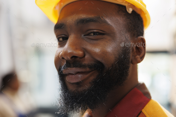 Smiling african american warehouse package handler face portrait