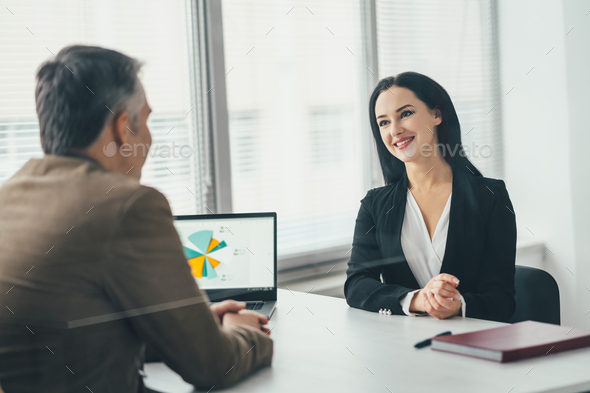 The business woman and a man talking at the office table Stock Photo by ...
