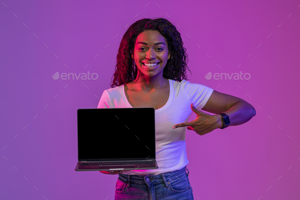 Online Ad. Happy African American Woman Pointing At Blank Laptop Computer Screen