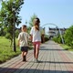 Brother and Sister Walking in the Park Holding Hands - VideoHive Item for Sale
