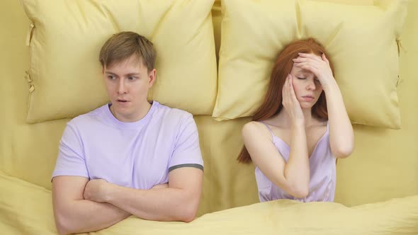 Couple Arguing at Night on Bed Male is Dissatisfied with Wife Behavior