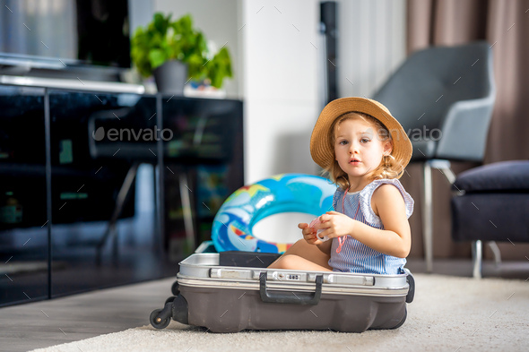 Little girl with discount suitcase