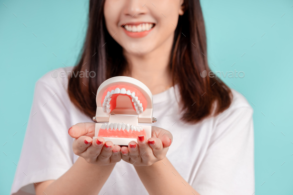 Dental of asian woman with tooth sample and white teeth increase ...