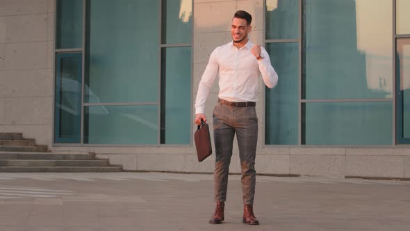 Fulllength View Arabic Spaniard Business Man Leader Manager Holding Laptop in Case Briefcase alt